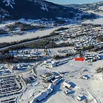 Alpinlandsby Pluss Leilighet